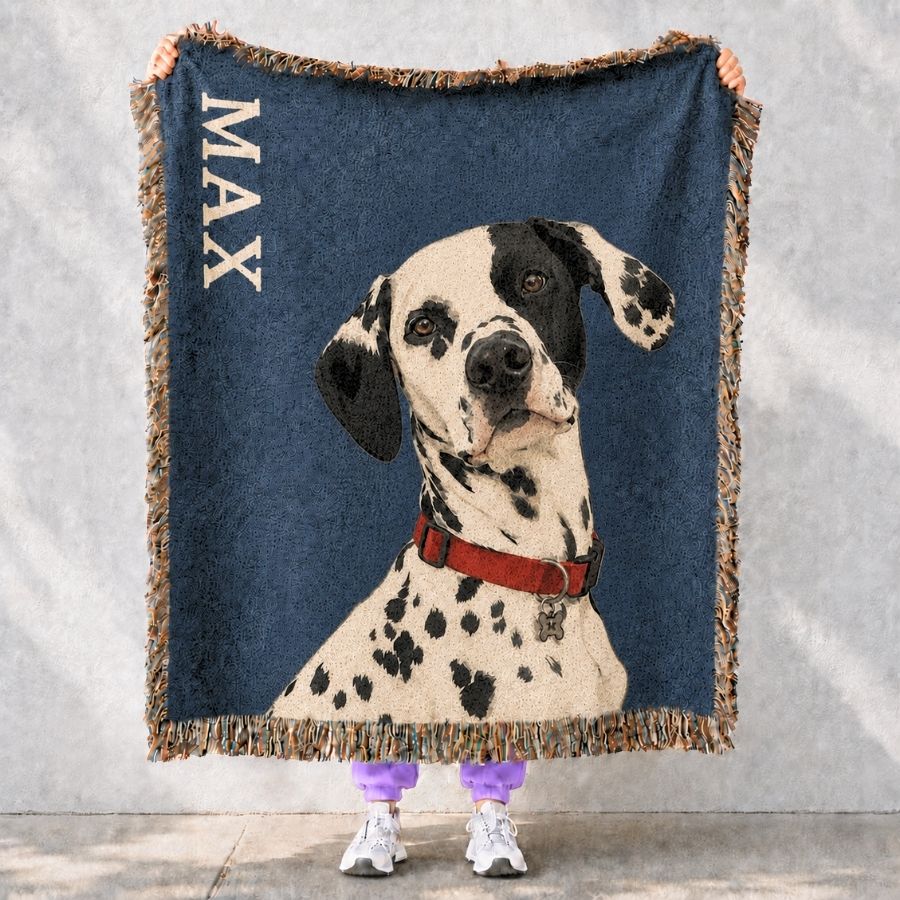 Woven blanket with a dalmatian dog design and the name 'Max' on a gray background